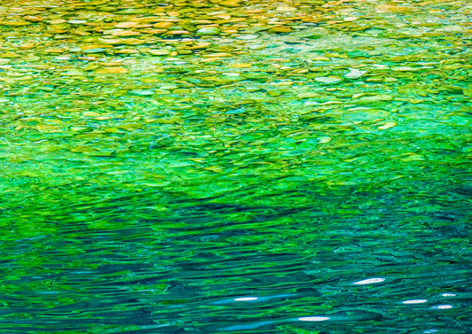Crystal Creek — fine art photograph of crystal clear creek water with vivid emerald green, gold and teal rippling patterns, archival nature print