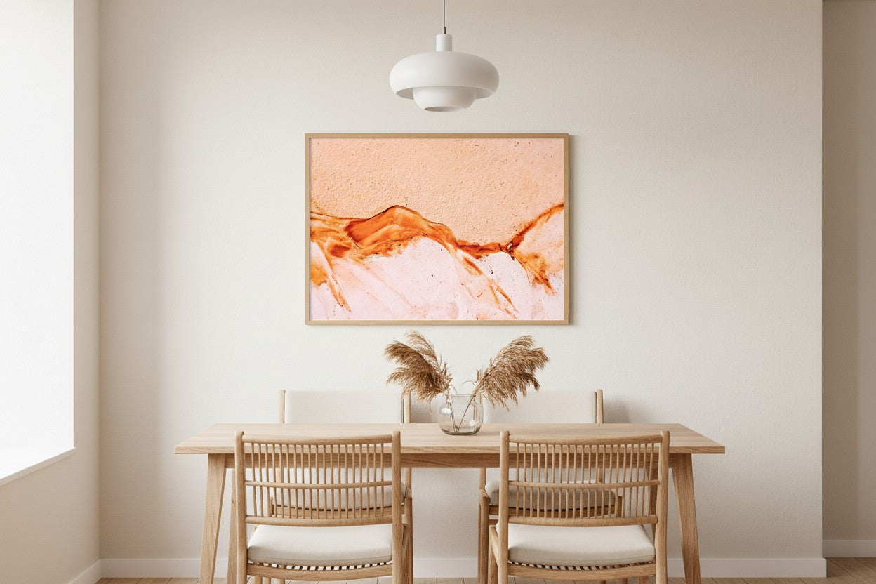 K'gari Sand fine art print in a thin timber frame in a bright minimalist dining room with rattan chairs and dried pampas grass — unframed Australian wall art