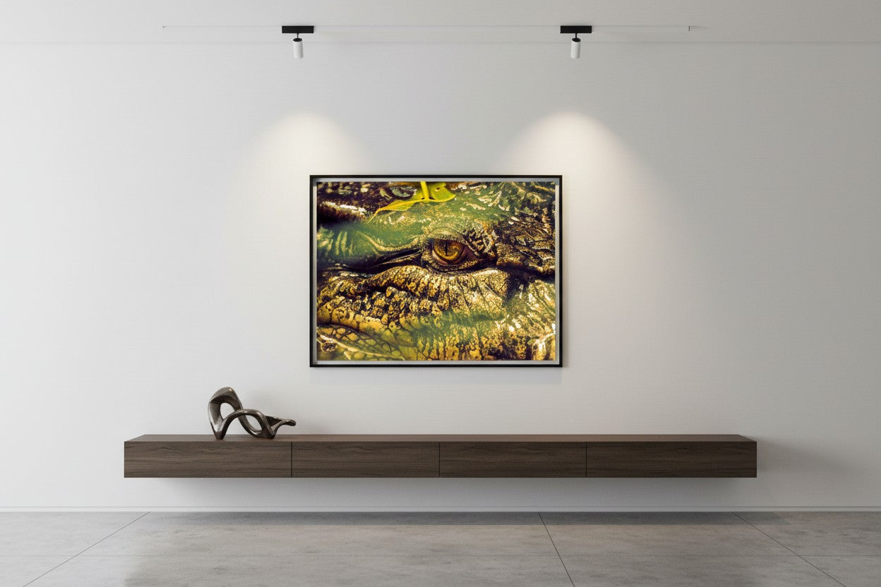 Ancient Watcher tropical wildlife fine art print in a thin black frame above a dark timber console in a dramatic minimalist hallway with polished concrete floors — unframed wildlife wall art