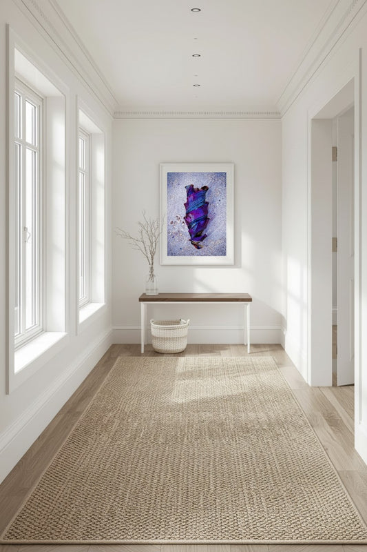 Baby Shark Egg fine art print in a white mat frame above a white console table with dried stems in a bright Hamptons-style hallway — unframed coastal wall art