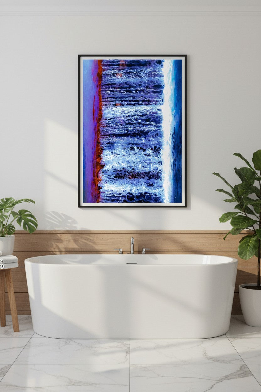 Fruit Bat Falls abstract waterfall fine art print in a thin black frame above a freestanding bathtub in a luxurious spa-style bathroom with marble tiles and green plants — unframed wall art