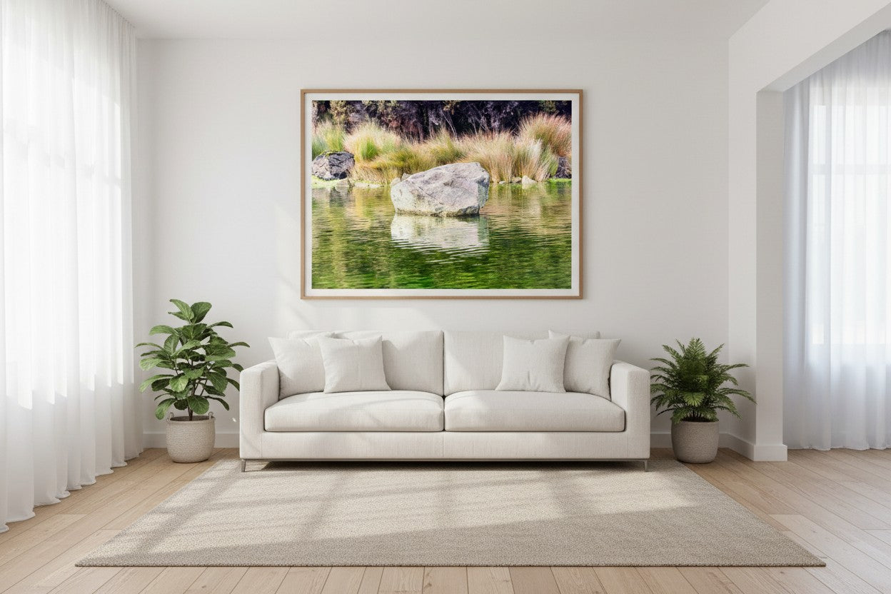 Kōhatu New Zealand river fine art print above a white linen sofa in a bright Australian living room — unframed wall art