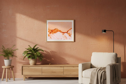 K'gari Sand fine art print in a thin timber frame on a warm terracotta feature wall in a sophisticated contemporary living room — unframed Fraser Island wall art