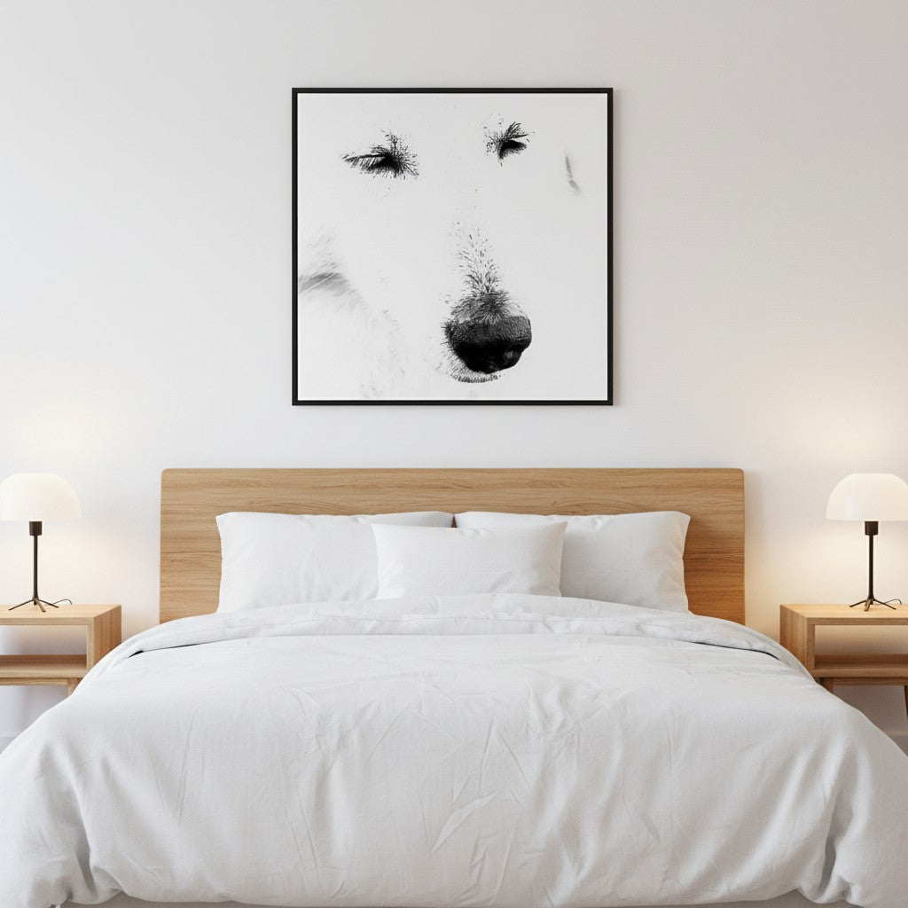 Mystery Maremma fine art portrait in a thin black frame above a bed in a calm minimalist bedroom with white linen — unframed black and white wall art