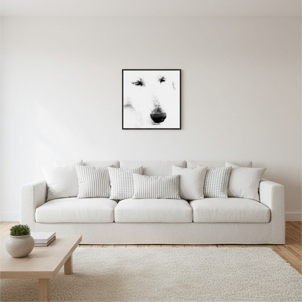Mystery Maremma fine art portrait in a thin black frame above a white linen sofa in a bright Scandinavian living room — unframed black and white wall art