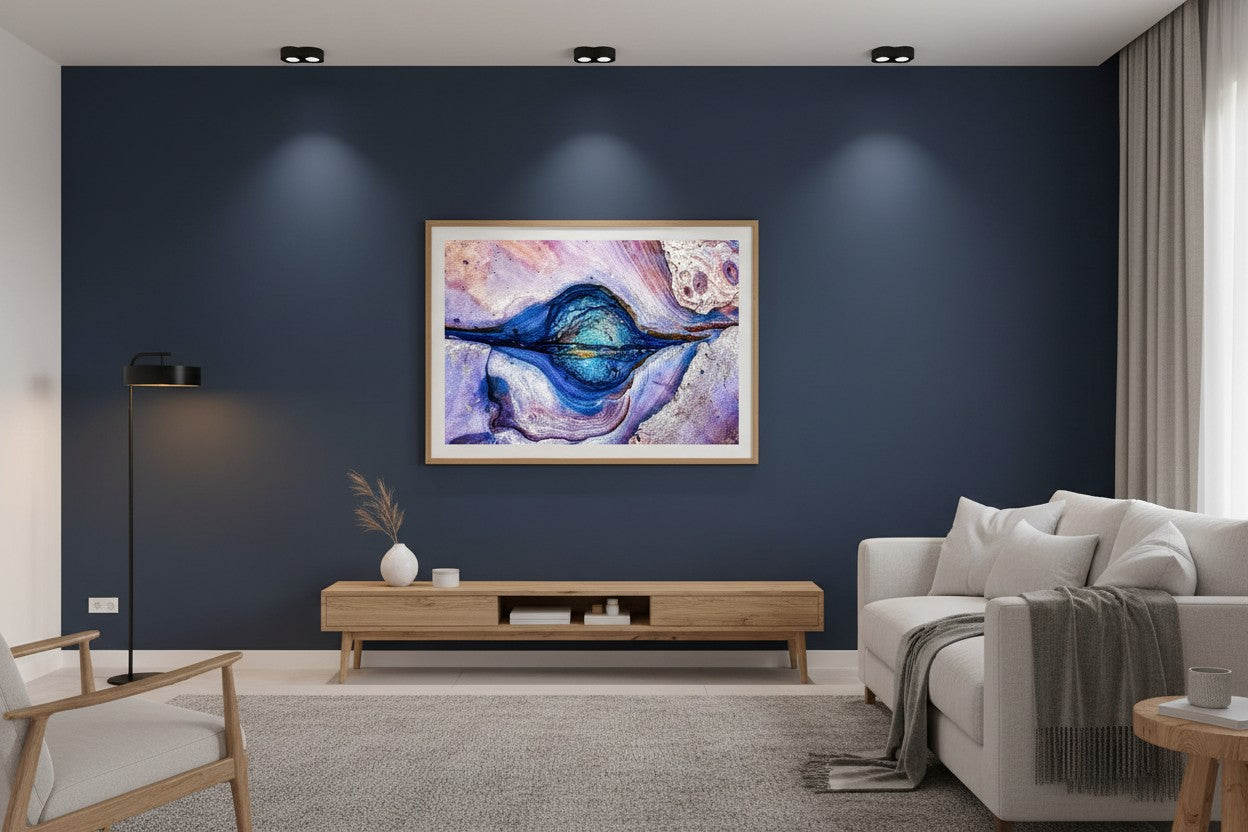 Rock Pool abstract coastal fine art print in a thin timber frame on a deep navy feature wall in a sophisticated contemporary living room — unframed coastal abstract wall art