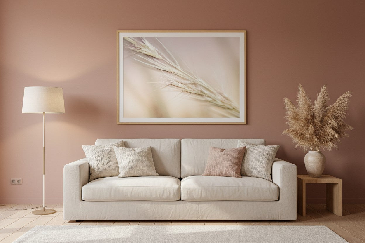 Soft Stillness fine art print in a thin timber frame on a warm blush feature wall in a sophisticated calm living room with cream linen and dried pampas grass — unframed wall art