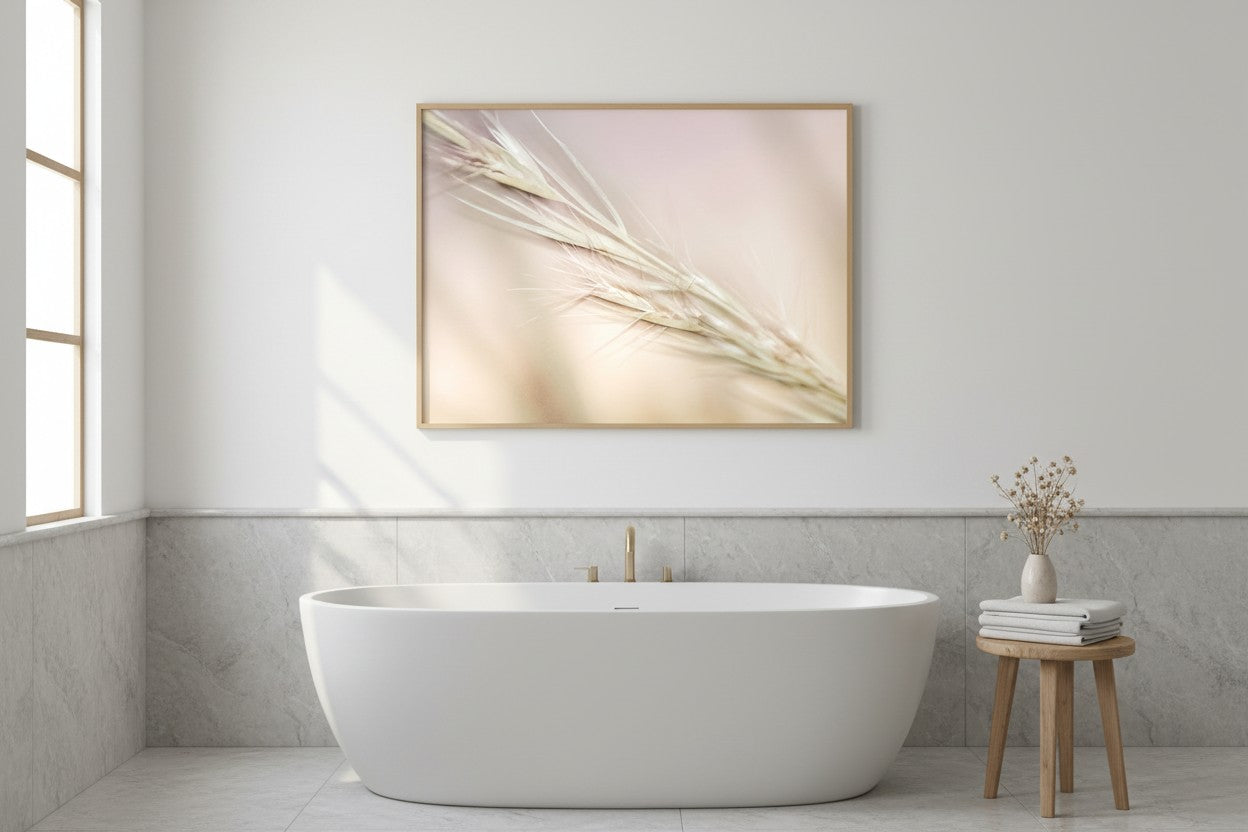 Soft Stillness fine art print in a thin timber frame above a freestanding bathtub in a luxurious spa-style bathroom with marble tiles and dried flowers — unframed wall art