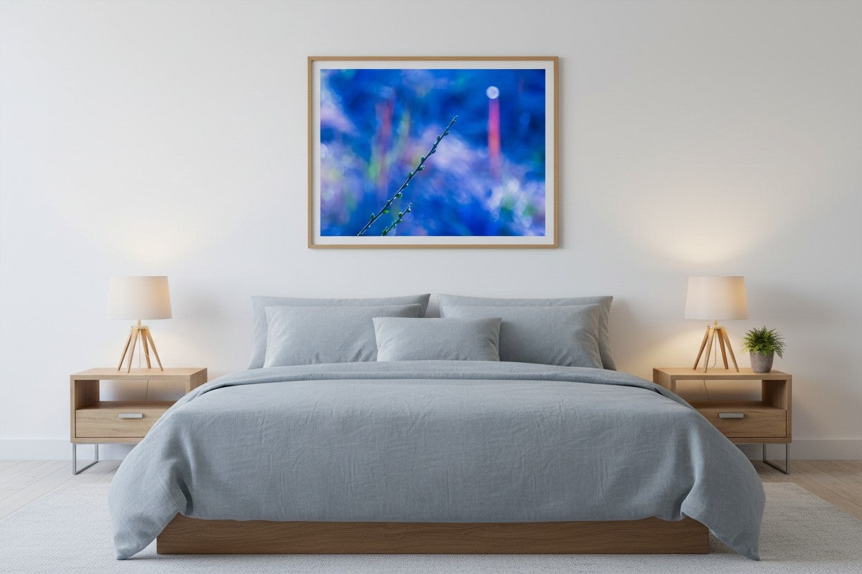 Towards The Light abstract botanical fine art print above a bed in a calm blue-grey bedroom — unframed wall art